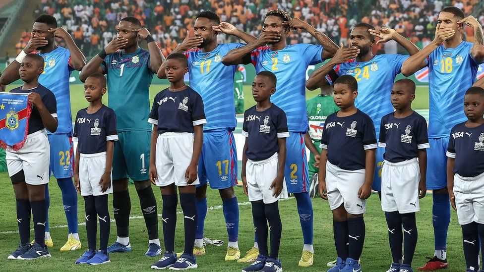 DR Congo players make a symbolic protest during the national anthem ahead of their Nations Cup semi-final defeat to Ivory Coast