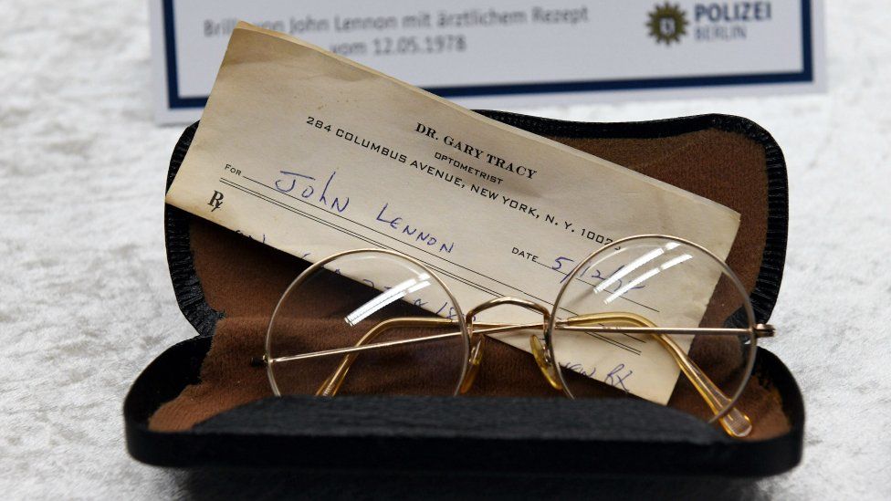 Glasses from the estate of John Lennon are pictured during a press conference on November 21, 2017 in Berlin.