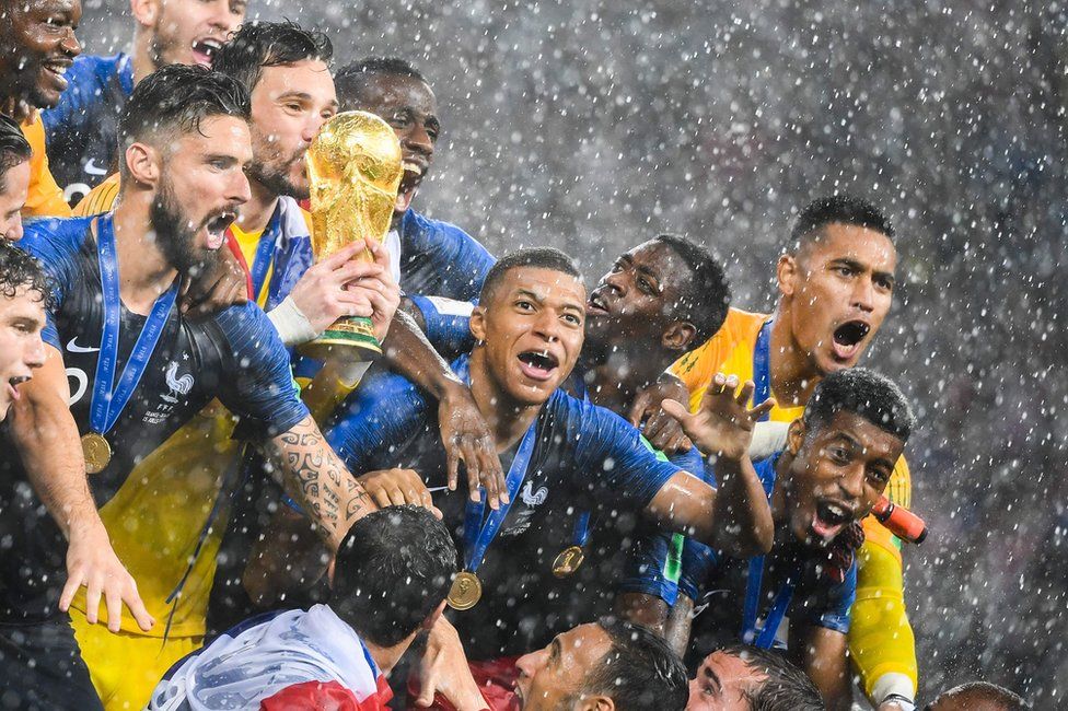 France's players lift the World Cup trophy after winning the Russia 2018 World Cup final football match between France and Croatia at the Luzhniki Stadium in Moscow on July 15, 2018.