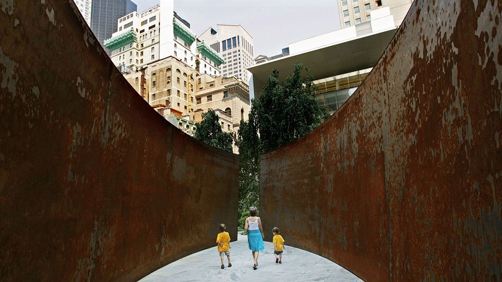 Grandmother Linda Gralitzer (C) walks with her grandchildren Max (L) and Sadie Goldstein through a Richard Serra sculpture during the annual Grandparent's Day at the Museum of Modern Art June 26, 2007 in New York City.