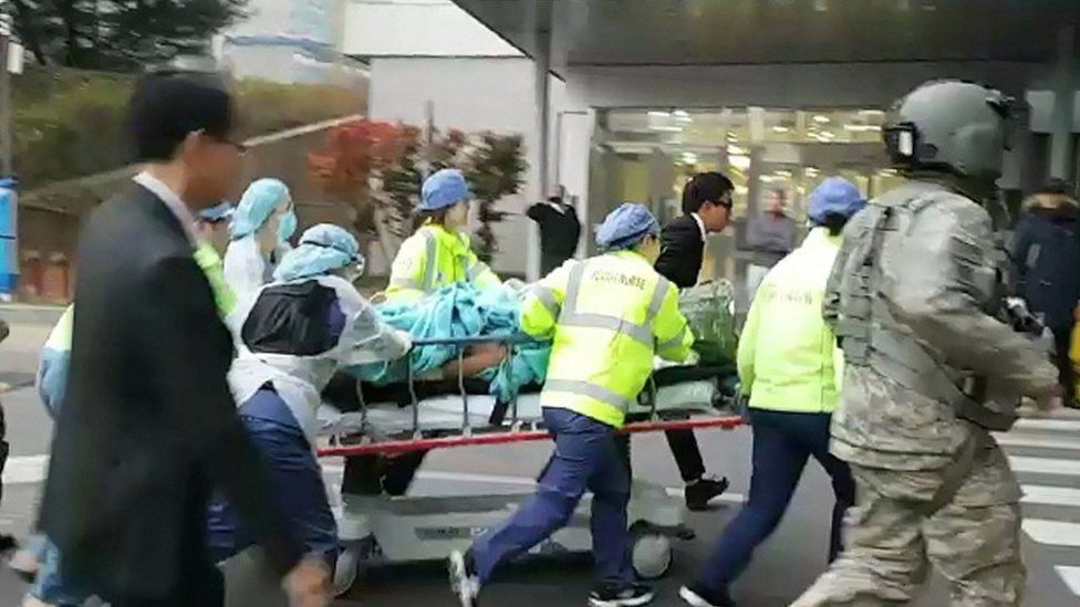 The North Korean soldier is rushed on a stretcher into a hospital in Suwon, Gyeonggi Province, 13 November 2017