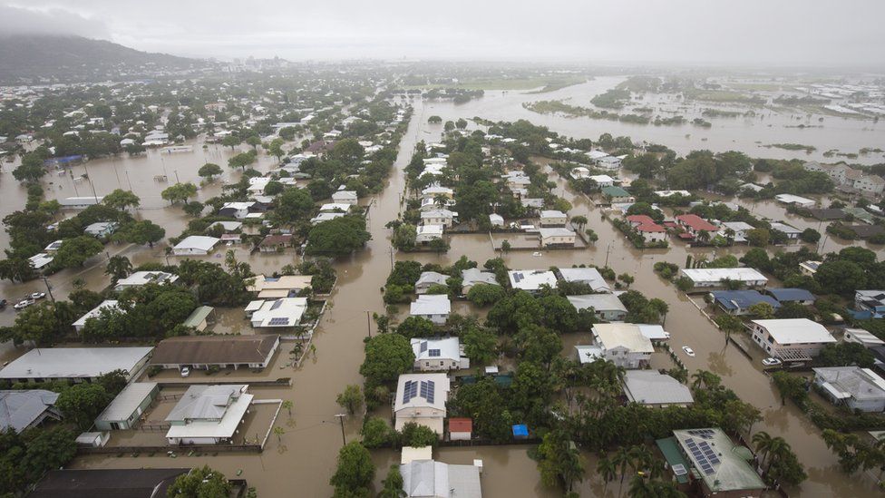 An aerial picture of Townsville's houses half-submerged in flood waters