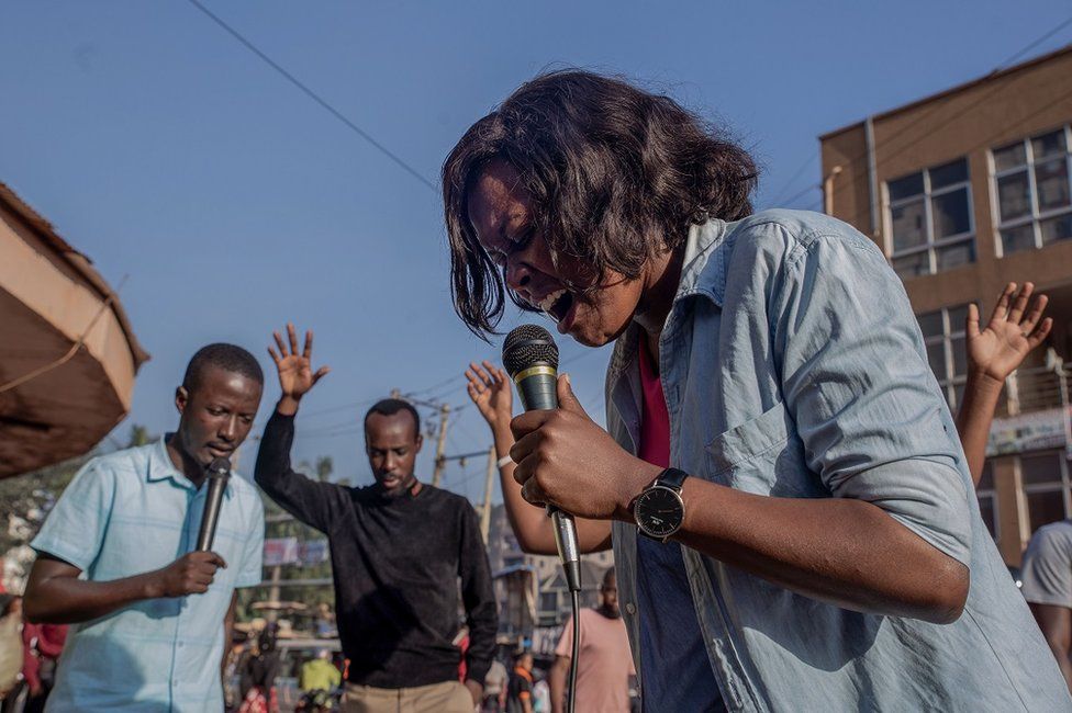 A woman speaking into a microphone