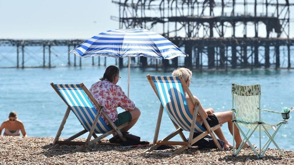 People sunbathing in Brighton