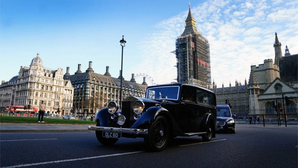 The hearse carrying the coffin of Sir David Amess MP crosses Parliament Square after leaving the Palace of Westminster where it laid in the chapel overnight