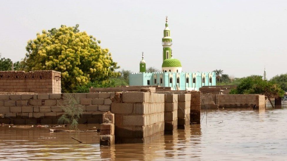 A mosque and house walls are partially submerged in water following heaving floods in Wad Ramli, some 45 km north of Khartoum, Sudan, 25 August 2019.