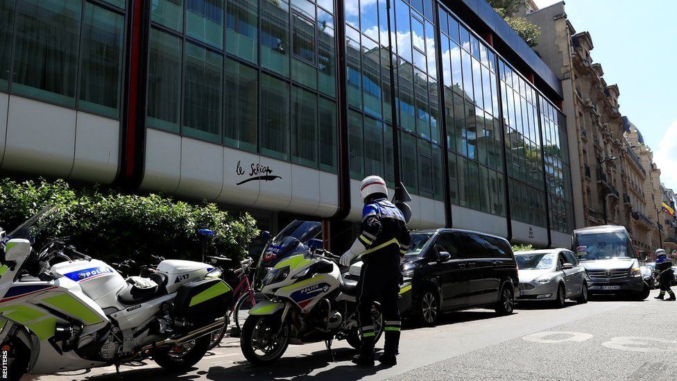 French police in front of the Hotel de Berri in Paris after Confederation of African Football president Ahmad was questioned by authorities last week.