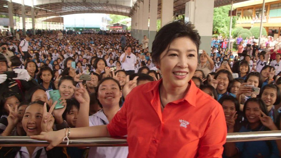 Former Thai Prime Minister Yingluck Shinawatra appears at a school