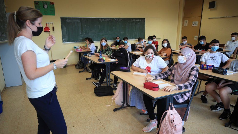 Pupils and a teacher wearing face masks at a school in Bonn, Germany