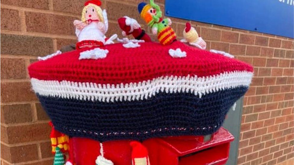 A postbox topper with a festive theme