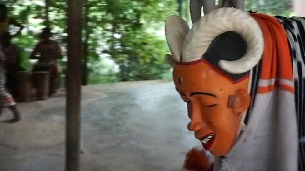 Masked dancer in Ivory Coast