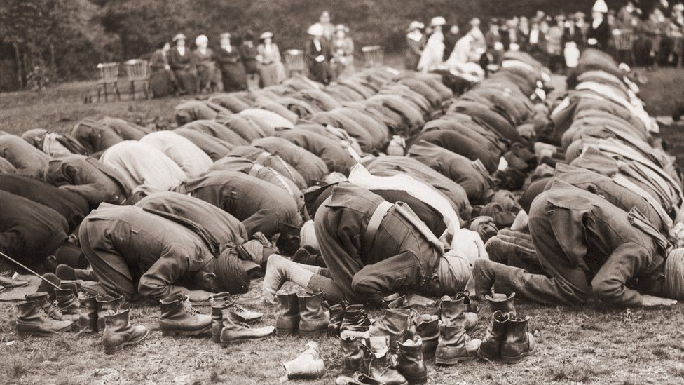 Indian troops serving with the British Army pray outside the Shah Jahan Mosque in Woking, Surrey.