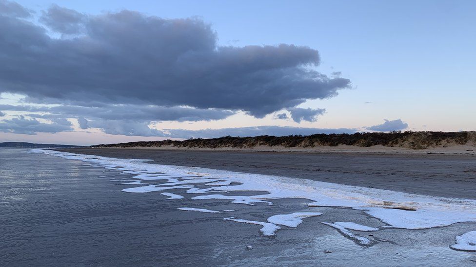 Frozen sea foam at Berrow Beach in North Somerset
