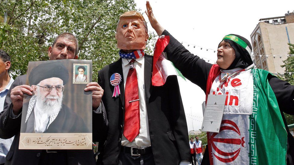 Iranian demonstrators carry portrait of Ayatollah Ali Khamenei and an effigy of US President Donald Trump - 10 May 2019