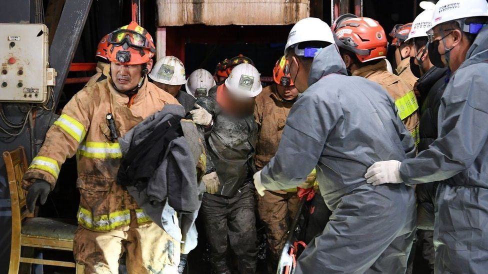 Two miners are pulled to safety after the collapse of a mine in South Korea