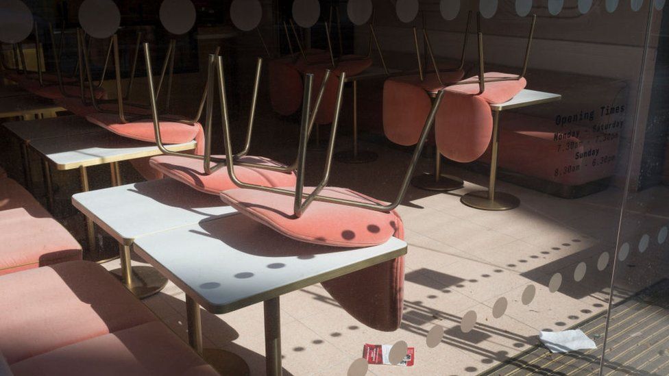 upturned chairs in empty restaurant