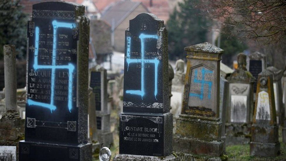 Graves desecrated with swastikas are seen in the Jewish cemetery in Quatzenheim, near Strasbourg, France, on 19 February 2019