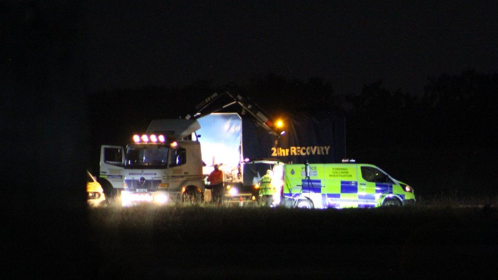 Lorry and police van at scene of the crash