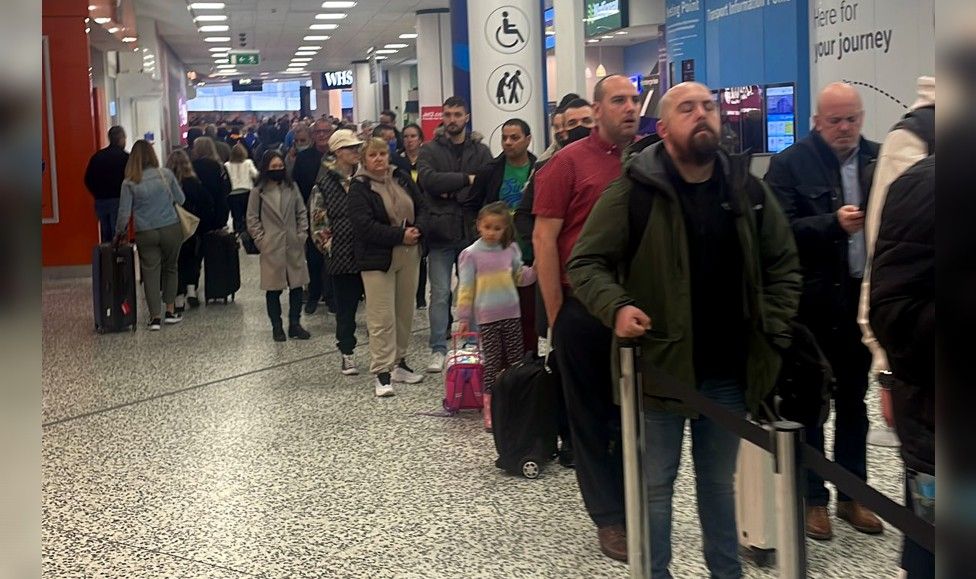 Long queues of holidaymakers at Birmingham Airport