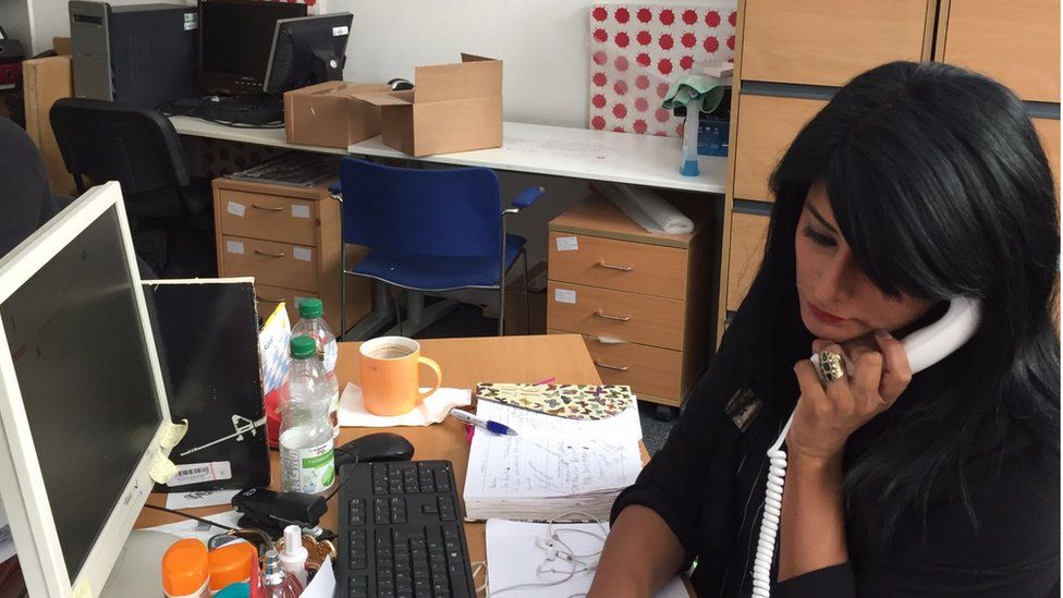 Maz Saleem, anti-racism campaigner, on the phone in her office.