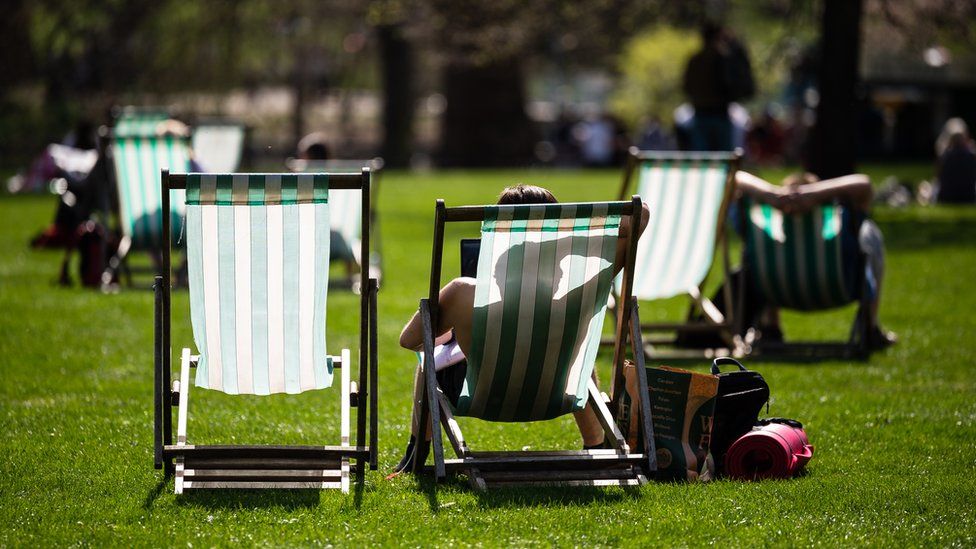 Sunbathers in St James' Park, London