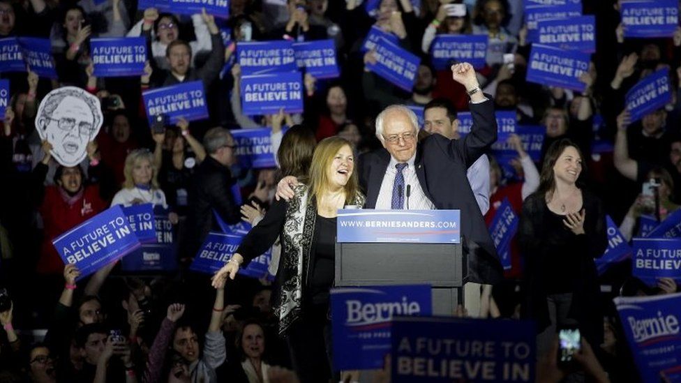 Democratic presidential candidate Bernie Sanders stands on stage with his wife during his Caucus night event at the at the Holiday Inn - 1 February 2016 in Des Moines, Iowa, the US