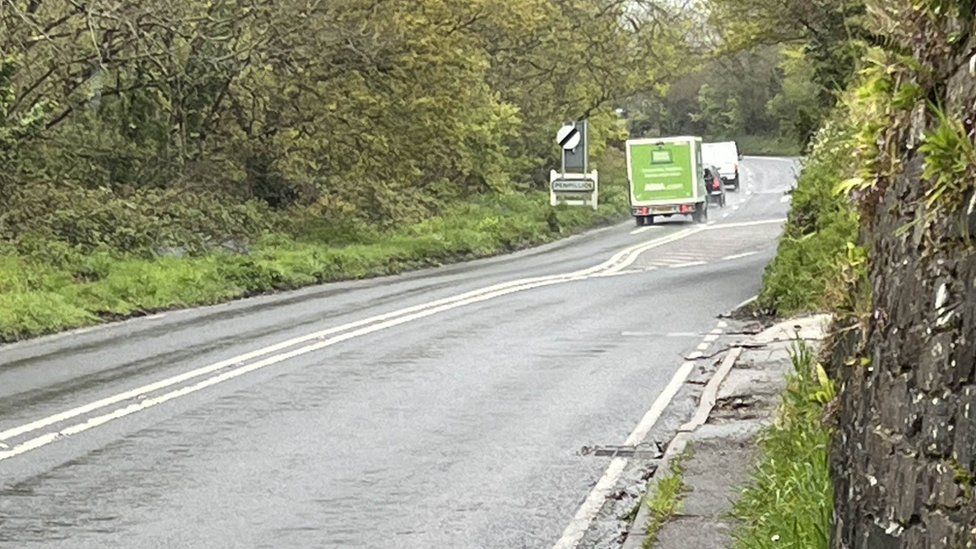 Vehicles on the A390 near the site of a fatal crash