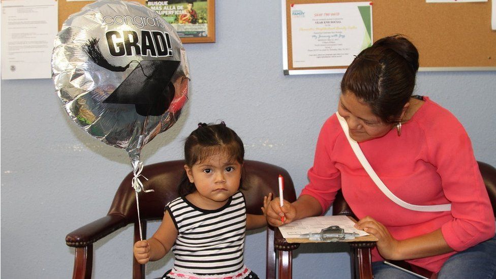 Woman and little girl at a Hispanic Outreach Center, Pinellas