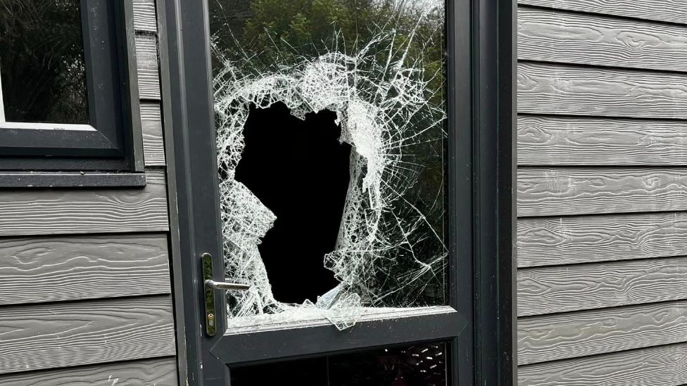 Little Miracles burglary showing a broken glass panel door