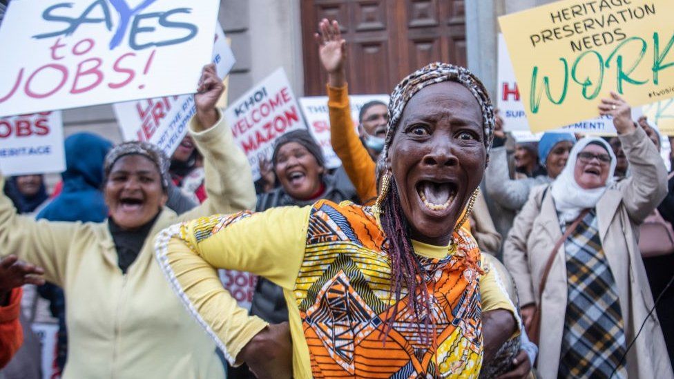 Woman with a shocked face expression at a protest with he First Nations Collective outside the Western Cape High Court in Cape Town, South Africa - Wednesday 27 July 2022