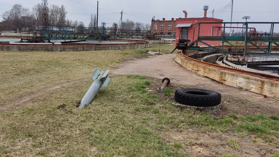 An unexploded missile lodged in the ground at a water treatment plant