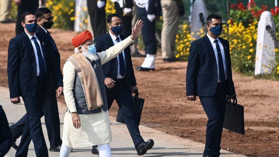 India's Prime Minister Narendra Modi (C) waves as he leaves after attending the Republic Day parade in New Delhi on January 26, 2021.