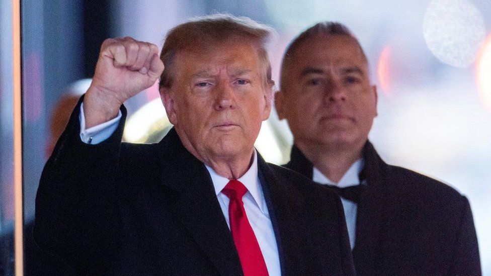 Former U.S. President Donald Trump gestures to his supporters, as he departs for his second civil trial after E. Jean Carroll accused Trump of raping her decades ago, outside a Trump Tower in the Manhattan borough of New York City, U.S., January 26, 2024.