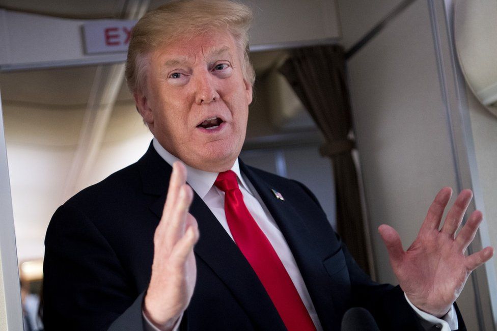 President Donald Trump speaks to the press on board Air Force One en route to New Jersey, June 29, 2018