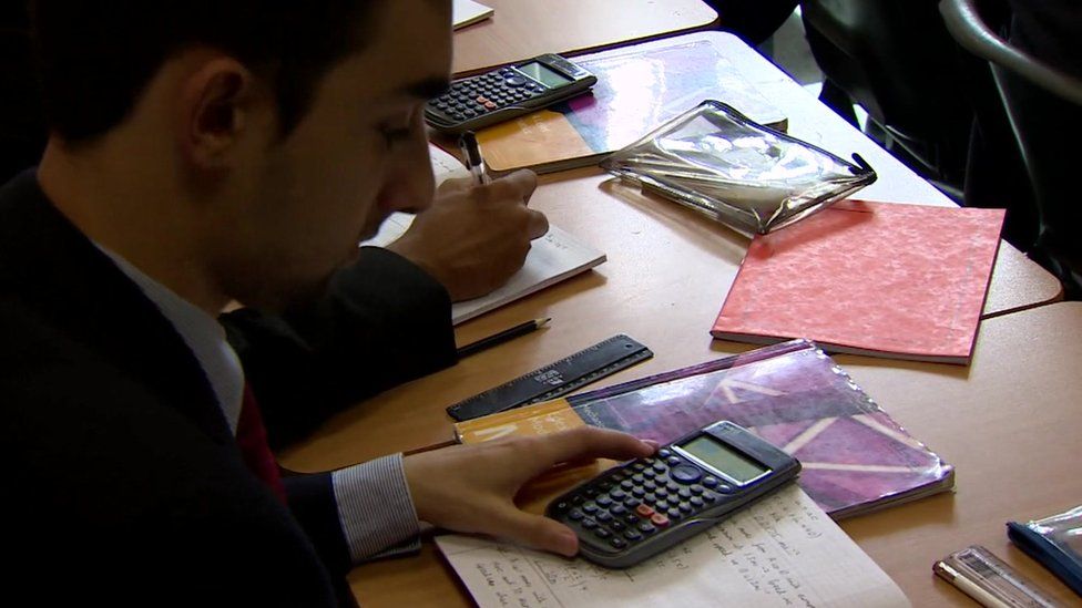 Close up boy in maths class