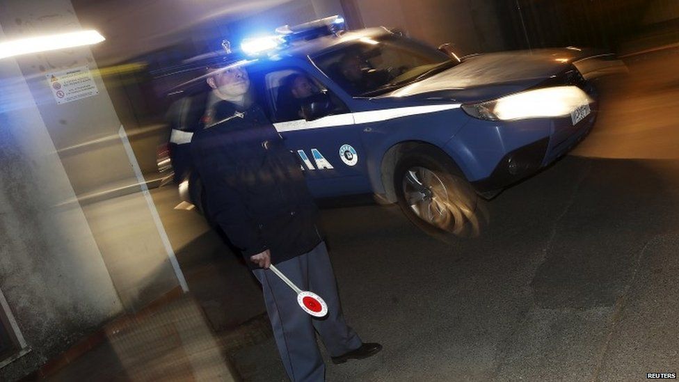 An Italian police car leaves a police station near Catanzaro, Italy May 7, 2015