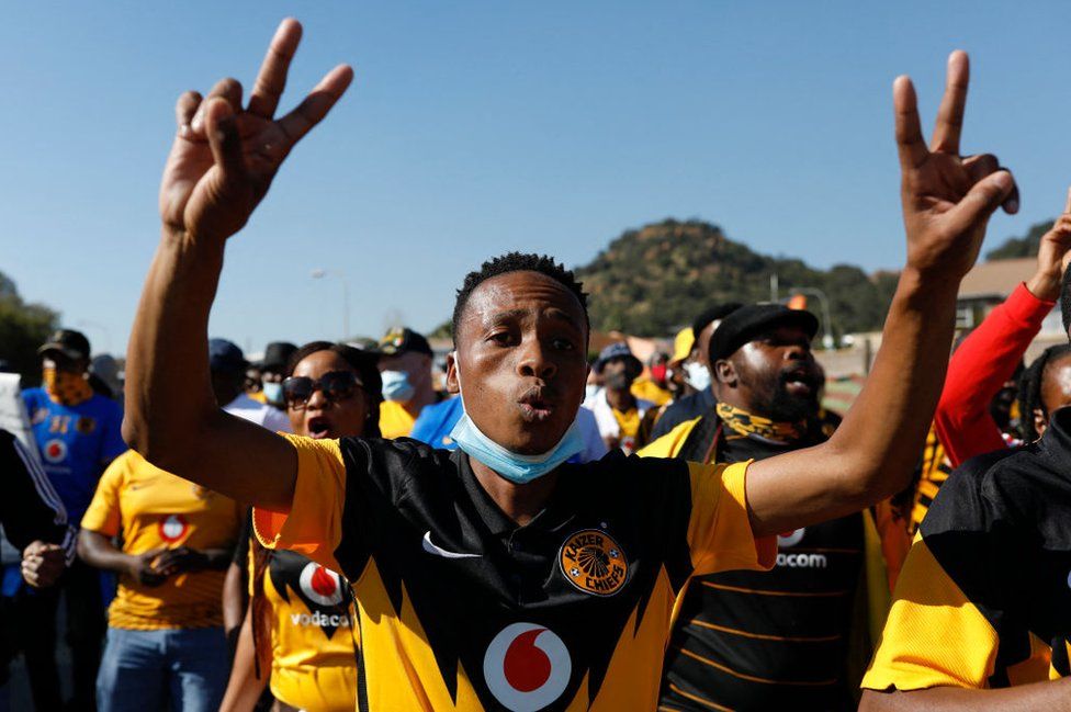 A Kaizer Chiefs football club supporter gestures during a march to deliver a memorandum of concerns relating to the running of the club at the Chiefs Village in Naturena, Johannesburg on 14 May 2021.