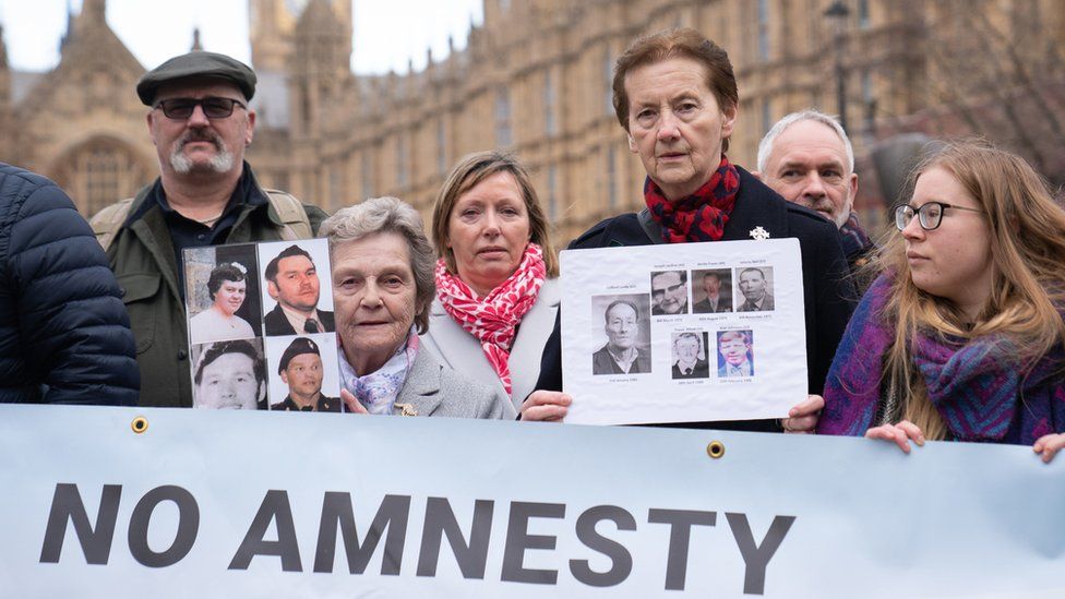 Relatives of those killed in the Troubles stage a protest outside Westminster in response to the controversial bill