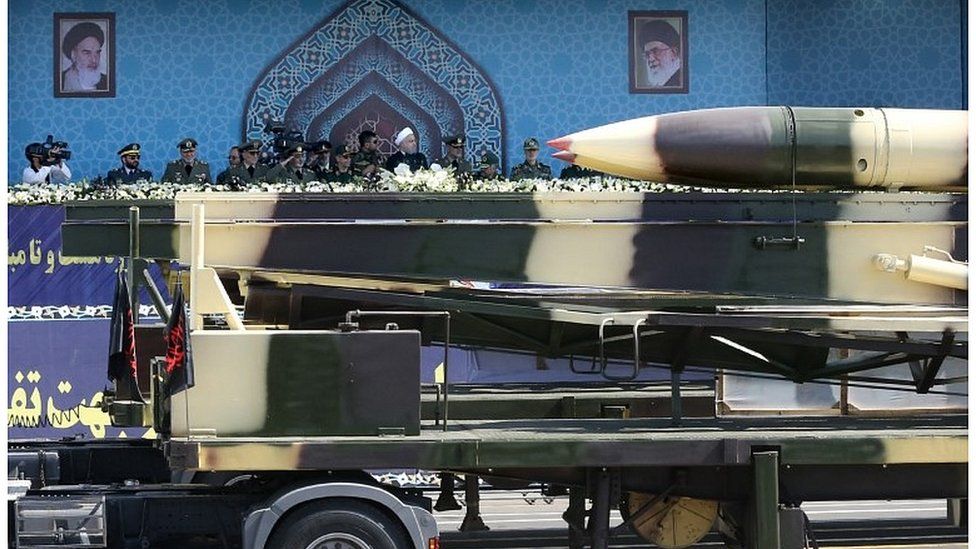 Missiles are displayed as Iranian President Hassan Rouhani attends an armed forces parade in Tehran