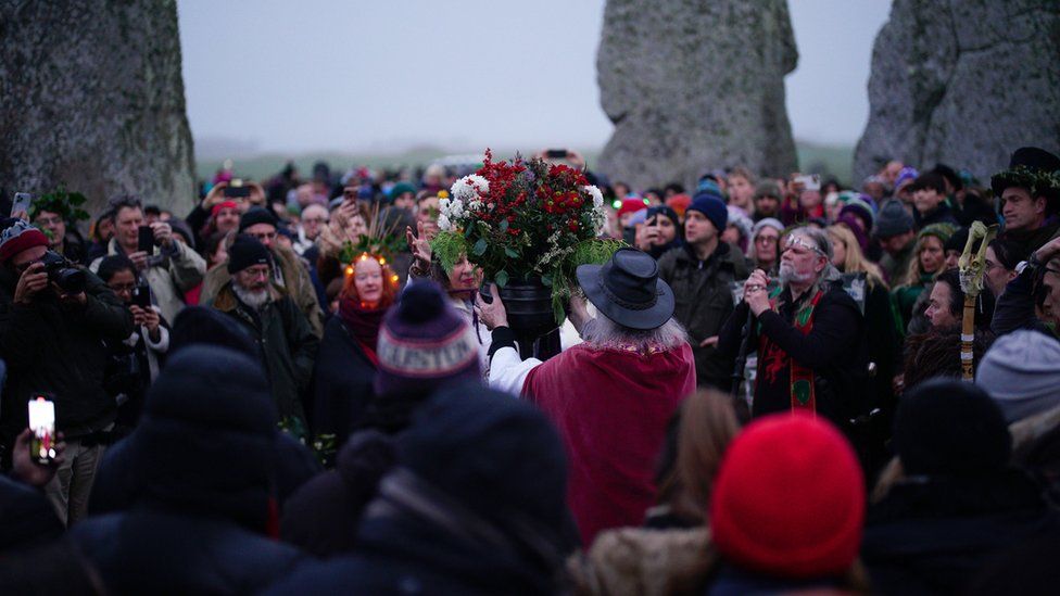 People celebrating at Stonehenge