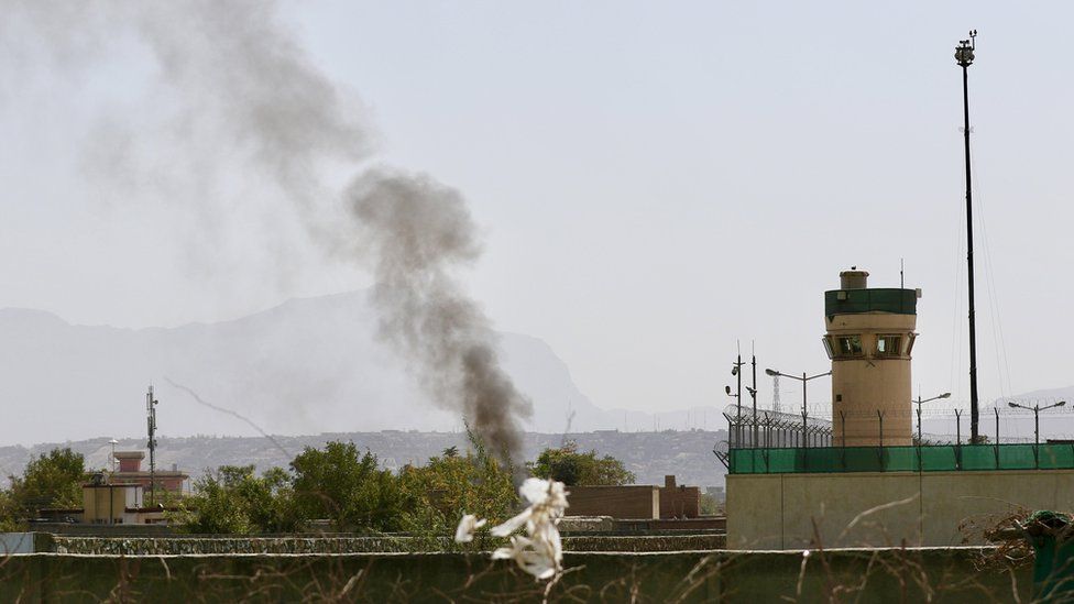 Smoke billows at Kabul airport after several rockets were fired at it