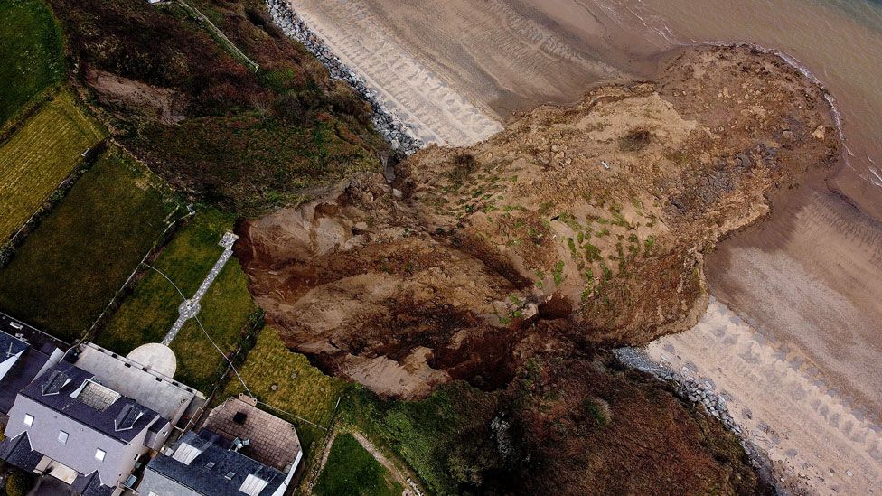 An aerial view of a large landslide onto a beach in the village of Nefyn, Wales