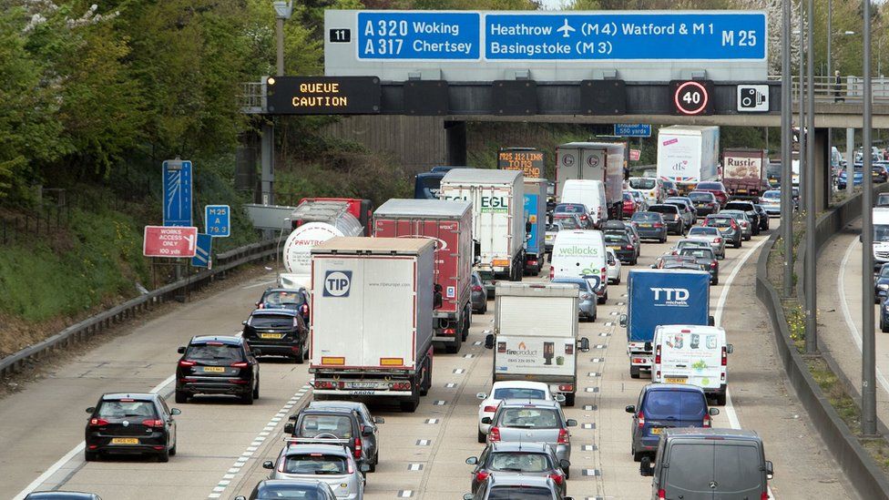 Slow-moving traffic on the M25 near Addlestone, Surrey