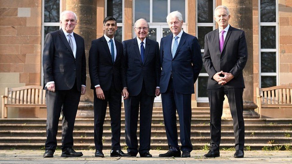 Former Taoiseach Bertie Ahern, British Prime Minister Rishi Sunak, former US Senator George Mitchell, former US president Bill Clinton, and former British Prime Minister Sir Tony Blair stand together at Hillsborough Castle for the Gala dinner to mark the 25th anniversary of the Good Friday Agreement, in Belfast,
