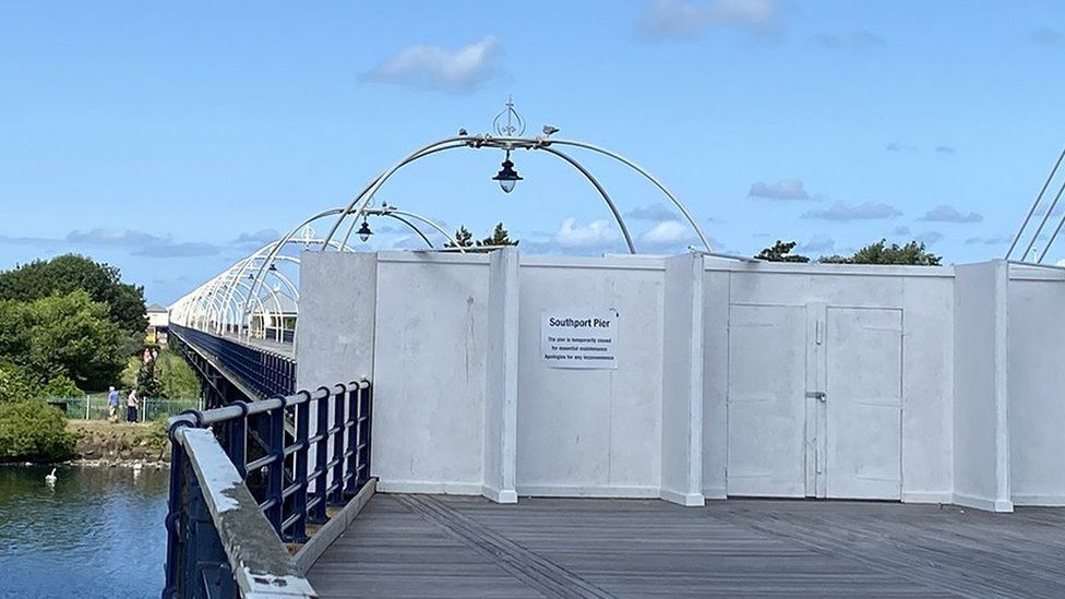 Southport Pier with boards across to show it's closed