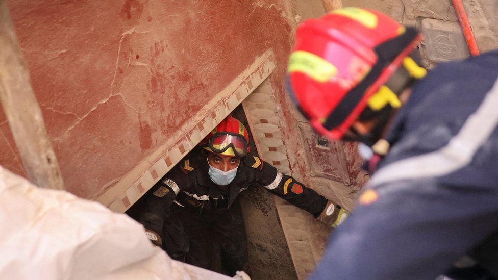 Emergency workers search a destroyed house in Amizmiz, Morocco