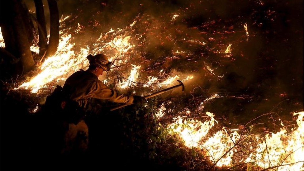 A CalFire firefighter battles the Tubbs Fire near Calistoga, California on 12 October.