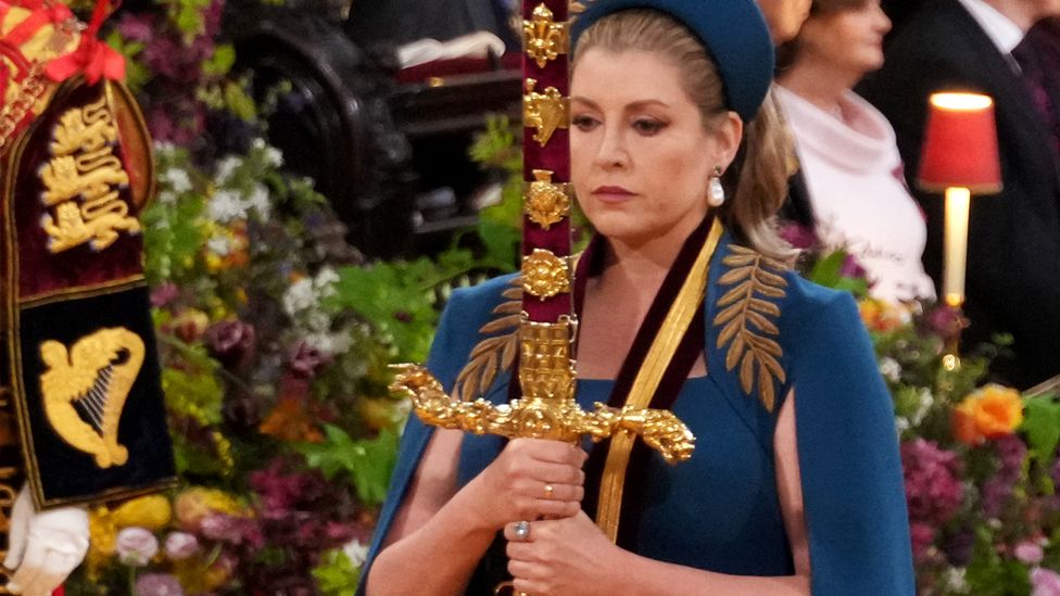 Lord President of the Council, Penny Mordaunt, carrying the Sword of State, in the procession through Westminster Abbey ahead of the coronation ceremony of King Charles III and Queen Camilla in London on 6 May 2023