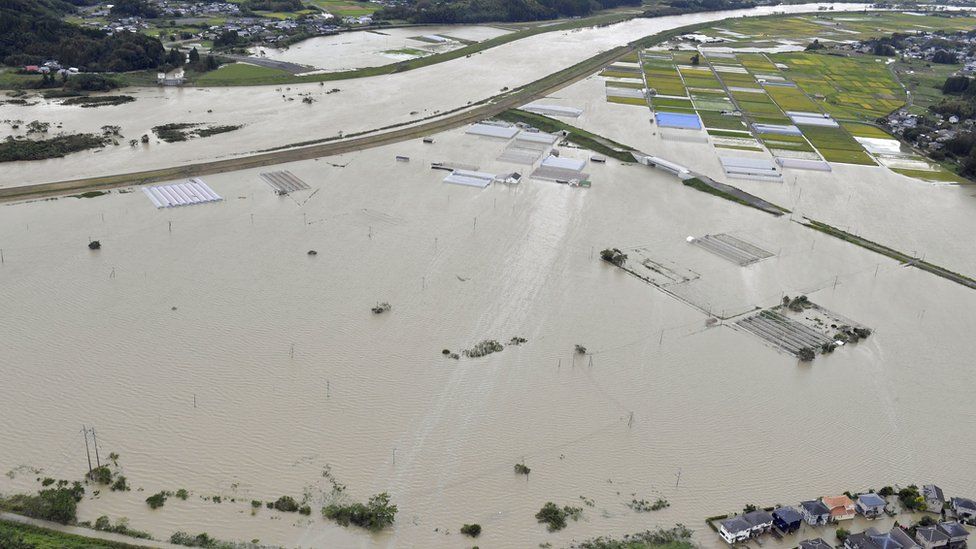 An aerial view shows submerged houses at a flooded area caused by heavy rains due to Typhoon Nanmadol in Kunitomi, Miyazaki Prefecture on the island of Kyushu, Japan September 19, 2022.