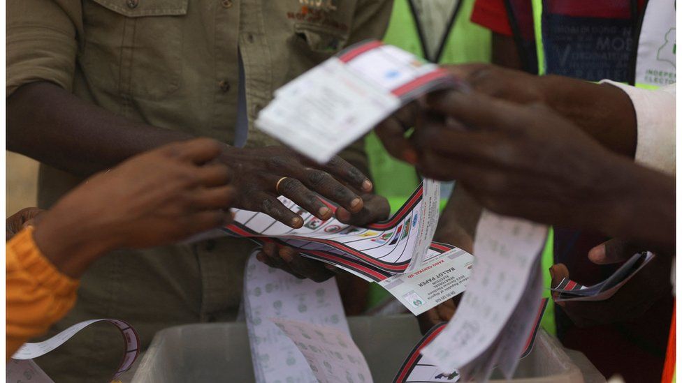 Election officials sort out ballot papers at a polling station in Kano, north west Nigeria